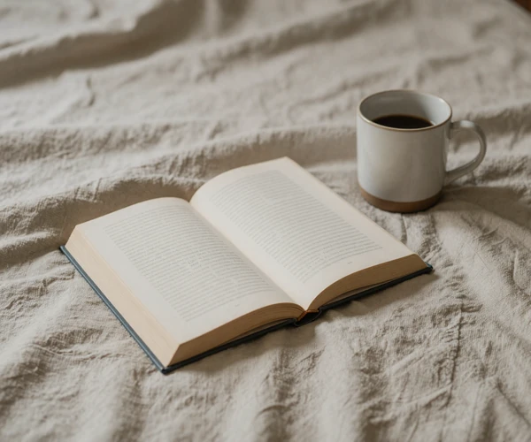 Still life of a book and mug - pairing with the Living With Micropenis essays